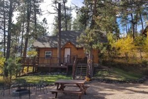 This is Pine Lodge #1 description Pine Lodge Exterior at Rustic Ridge Guest Cabins