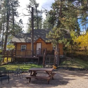 This is Pine Lodge #1 description Pine Lodge Exterior at Rustic Ridge Guest Cabins