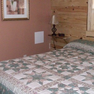 Bedroom 1 Mountain Shadows Bedroom at Rustic Ridge Guest Cabins