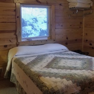 Timber Ridge Bedroom 1 at Rustic Ridge Guest Cabins
