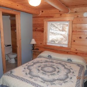 Bedroom 1 Pine Lodge Bedroom 1 at Rustic Ridge Guest Cabins